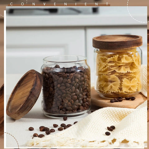 Two 17 Oz glass jars with tight wood lids, one with coffee beans and one with pasta, from 24 Pack Glass Canister Set With Tight Wood Lids For A No Sweat Pantry Setup.