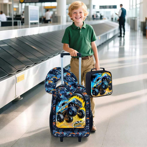 Three-piece kids luggage set with blue monster-truck print; 18-inch wheeled suitcase, neck pillow, and square lunchbox.