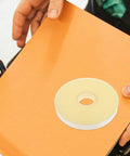 Heavy Duty Strapping Tie For Machines And Box Packaging Pro Grade Fast Easy Packing Tape For Shipping on orange surface