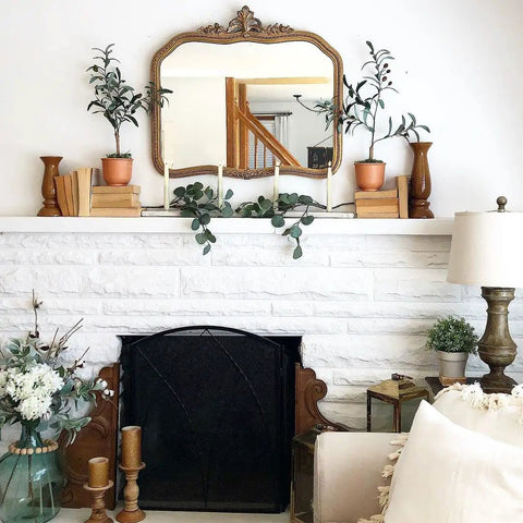 Elegant mantel with Flameless Taper Candle Set 4 Pack 9 Inch Ivory Wax With Realistic 3D Wick Flame Flickering LED Remote Control