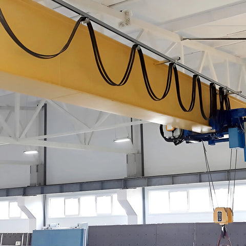 Four Wheel Cable Trolley System installed on a strut channel in a warehouse, showcasing smooth operation for safe lifting.