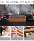 Slick Gray Solid Wood Jewelry Display Tray Featuring 12 Ring Slots on a black table with accessories.