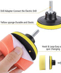 Hand holding Pro Grade Drill Buffing Kit with 14pcs polishing wheels and buffing pads for automotive detailing, yellow sponge.