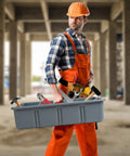 Worker holding Heavy Duty Multiuse Tote Tray With Six Dividers For Organizing Your Garage Tools Cleaning Supplies And Plumbing Gear