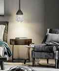 Teardrop Crystal Pendant Light In Black Dimmable LED Bubble Ceiling Fixture With Adjustable Metal Rods illuminating a bedroom.