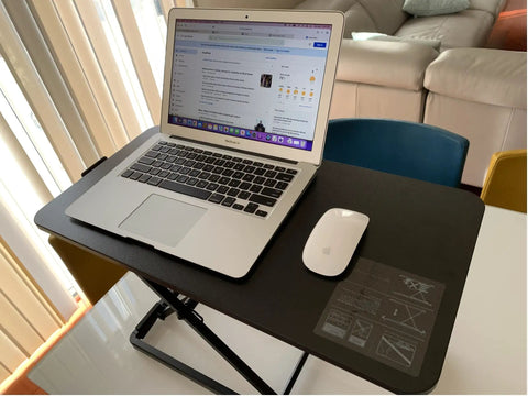 Ultra Slim 24 Inch Laptop Keyboard And Mouse Stand With Sit Stand Adjustable Riser for Standing Desks with laptop and mouse.