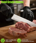 TreeGo 6-mil black nitrile gloves on hands slicing two raw beef steaks with a knife on a wooden cutting board