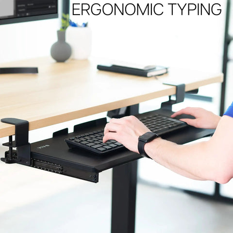 Under Desk Keyboard Tray With Heavy Duty Clamp Mount System 27 Inch Sliding Keyboard Drawer For Ergonomic Typing And Mouse Space Saving Pull Out Platform With Clamp Black KB05E installed on desk, showing ergonomic typing setup.