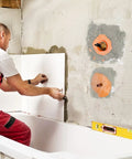 Installation of Eight Piece Pro Grade Waterproof Shower Seal Kit With Inside And Outside Corner Seals in a bathroom wall