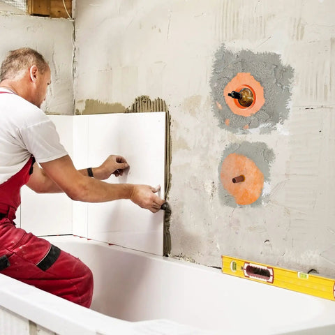 Installation of Eight Piece Pro Grade Waterproof Shower Seal Kit With Inside And Outside Corner Seals in a bathroom wall