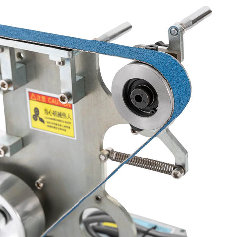 Heavy Duty Belt Grinder And Sander Featuring 6000rpm Variable Speed Control With Integrated VFD For Precision Polishing Jobs close-up of sanding belt and drive wheel.