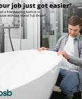 Man installing tub with Two Piece ABS Freestanding Tub Drain Kit And Rough In With No Fuss Install in bathroom.