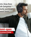 Man wearing Semi Open Over Ear Studio Headphones With 50mm Neodymium Drivers Wired For Monitoring Mixing And Music, sipping coffee