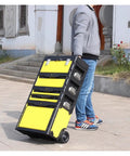 Person pulling the Four Layer Rolling Toolbox Organizer With Detachable Toolbox Multi Level Workstation Pull Handle Yellow