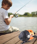 Boy using Spincast Fishing Reel For Beginners With Right Hand Retrieve Easy Push Button Casting Pre Wound Nylon Line