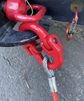 Close-up of Heavy Duty Alloy Steel Coupling Links 4 Pack 1/4 Inch Grade 80 Hammer Lock Chain Connectors in use on trailer.