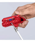 Close-up of hand using Ergostrip Universal Wire Stripping Tool for Right Handed Pros 135 mm Pro Grade Pistol Grip on a coax cable.