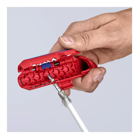 Close-up of hand using Ergostrip Universal Wire Stripping Tool for Right Handed Pros 135 mm Pro Grade Pistol Grip on a coax cable.