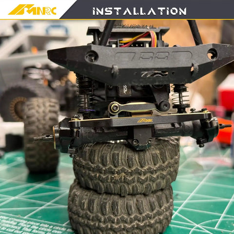 Beefy Brass Bold Steering Link Kit For Axial SCX24 AX24 1 Twenty Fourth Scale RC Crawler Upgrades Part Heavy Duty Link Set For Smoother Steering And Better Control installed on black front axle