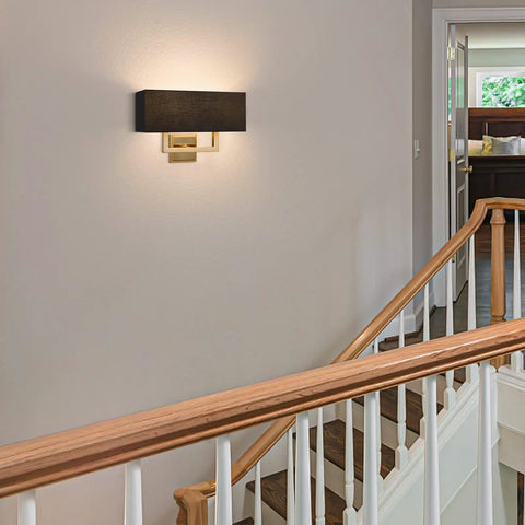 Sleek Mid Century Modern 16 Inch Two Light Wall Sconce In Cool Brass Gold Finish With Black Fabric Shade in hallway