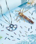 623 Pieces Glass Bugle Beads Set In Seven Dope Metallic Colors, tubular seed spacers displayed with jewelry projects
