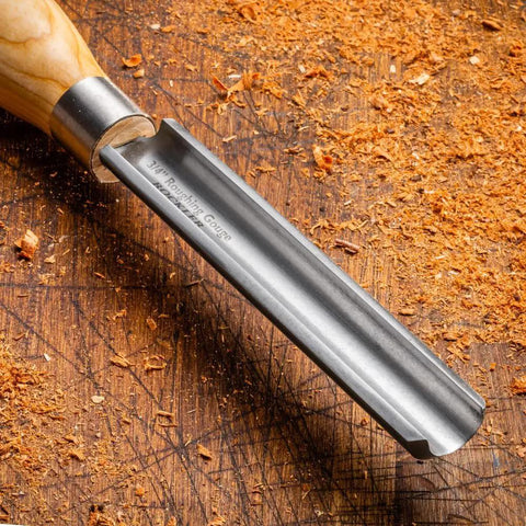 3/4 Inch Spindle Roughing Gouge with ash handle, high speed steel blade on wood table, wood lathe carving tool