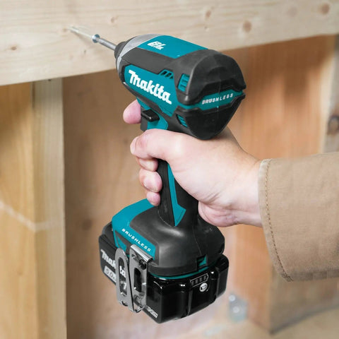 Person using the 18V LXT Brushless Cordless Drill And Impact Driver Combo Kit With 5.0Ah Batteries on wooden surface.