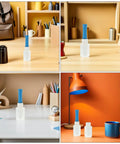 Four Rolls Stretch Film Wrap With Ergonomic Handles for moving and packing, displayed on a desk beside office supplies