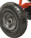 Close-up of 13-inch pneumatic tire on Push Broadcast Spreader 130 Lb Hopper Capacity Easy To Use Direct Rod Control 10 To 12 Ft Spread Width