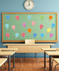 45 Piece Colorful Hot Air Balloon Cutouts For Bulletin Boards And Classroom Decor displayed on a classroom wall