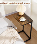 C Shaped End Tables Set Of 2 That Slide Under Your Sofa, Rustic Brown, next to bed with lamp and teacup, Model HET02BBR