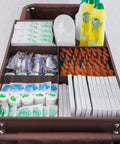 Straight Up Heavy Duty Three Tier Cleaning Cart With Two Roomy Cabinets And Smooth Rolling Wheels For Hotel Housekeeping Hustle Sturdy Painted Iron Frame Top Shelf Lid And Nifty Side Pocket Storage In Brown filled with cleaning supplies and toiletries.