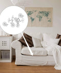Kickass Upholstery Twist Pins Clear Heads 100 Piece Set displayed on a couch securing a slipcover.
