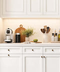 Antique Brass Cabinet Knobs Set on white kitchen cabinetry, showcasing 12 Pack, 1 Inch Round Dresser Drawer Knobs With Raised Fluted Groove
