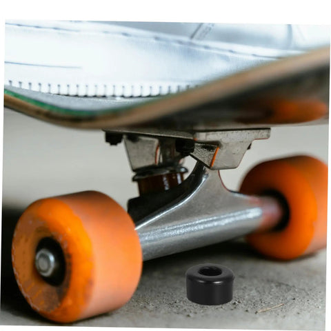 Orange wheeled quad skate with 10 Pack PU Shock Absorbing Cushions for Quad Skates visible on concrete surface