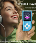 Person enjoying music on a 16GB Portable MP3 Player With Video, Voice Recorder, FM Radio, Ebook Reader, Photo Viewer, blue color