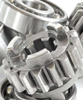 Assorted metal gears and bearings, showcasing components used in metalworking and machine assembly applications.