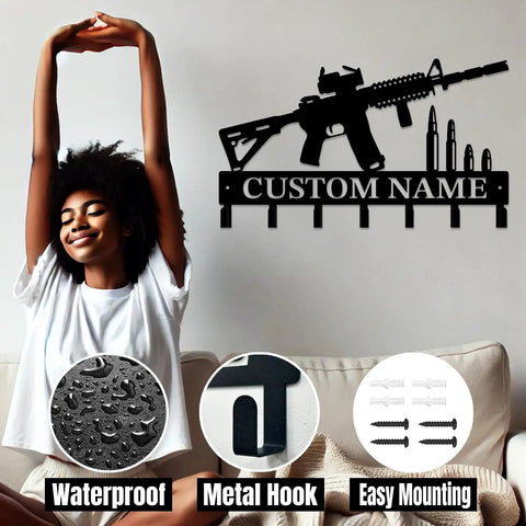 Custom Name Gun Themed Wall Hooks For Keys And Coats with metal gun design and name sign, shown with person relaxing nearby.