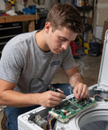 Person using 60W LED Display Soldering Iron Kit with Ceramic Heater on electronic circuit board in workshop.