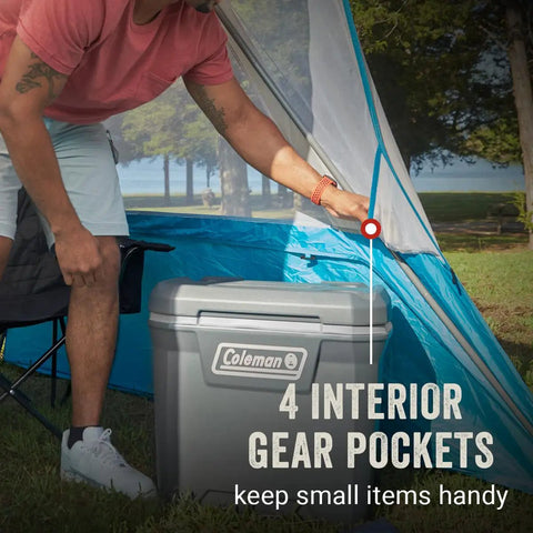 Person setting up Portable 7x7ft Backpack Sun Shelter with interior pockets, durable steel frame, for beach, park, camping use.