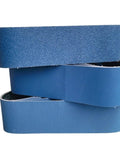 Pro Grade Calcined Aluminum Oxide Sanding Belts Set Of Five Four By Thirty Six Inch Assorted Grit Pack displayed in a stack.