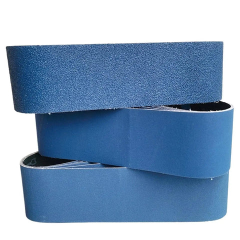 Pro Grade Calcined Aluminum Oxide Sanding Belts Set Of Five Four By Thirty Six Inch Assorted Grit Pack displayed in a stack.