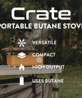 Crate Series butane camp stove on a table outdoors, showing its compact size and orange color. Text highlights features: versatile, compact, high output, uses butane.