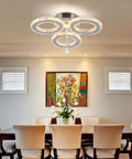 LED Crystal Pendant Ceiling Light With 3 Rings Cool Sleek Chandelier Flush Mount For Bedroom And Living Room above dining table.