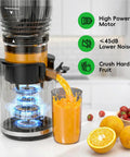 Amazon cold-press juicer with black and clear housing, 5.8-inch feed chute, pouring orange juice into a glass.