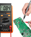 High Accuracy LCR Meter Digital Multimeter For Capacitance Resistance And Inductance With LCD Over Range Display in use with circuit board