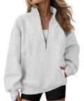 Woman wearing Women's Quarter Zip Oversized Fleece Pullover Hoodie Sweatshirt Mock Neck Sweater For Fall, Gray, Size M.