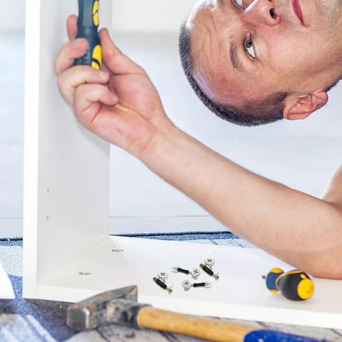 Man assembling furniture using 30 Sets M6 Three In One Furniture Fastener Kit With Zinc Alloy And Plastic for cabinet stability