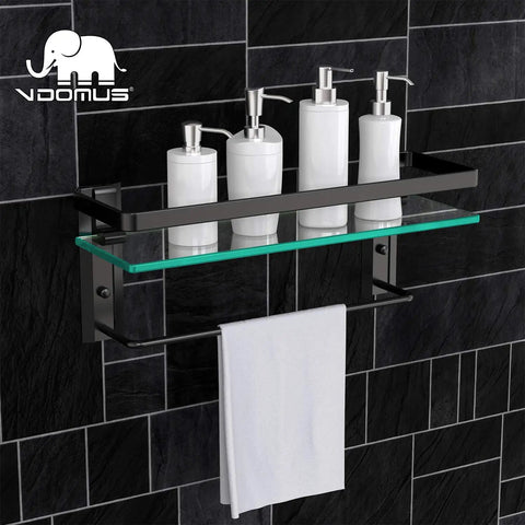 Tempered Glass Wall Shelf with Towel Bar for Bathroom, 15.2 by 4.5 Inches, mounted on dark tiled wall holding bottles and towel