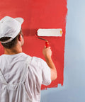 Person painting a wall with 15 Piece Mini Paint Roller Kit Featuring 4-Inch Cotton Rollers Perfect For Walls Edges And Furniture Updates.